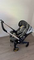 Poussette & Siège Auto Doona Gris  Gain de place absolu !