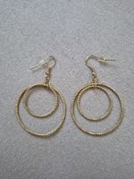 Boucles d'oreilles double anneau dorées style chic