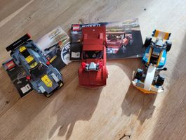 Drei Lego-Technik Rennautos mit Bauanleitung