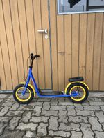 Kinderroller blau gelb mit Sattel gebrauchter Zustand