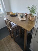 Wooden bar table with  4 chairs, good condition (Ikea)