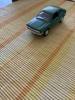 Modellauto VW Scirocco grün Türen und Kofferraum offen