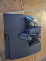 PlayStation 3 Konsole mit Controllern und 3 Spielen