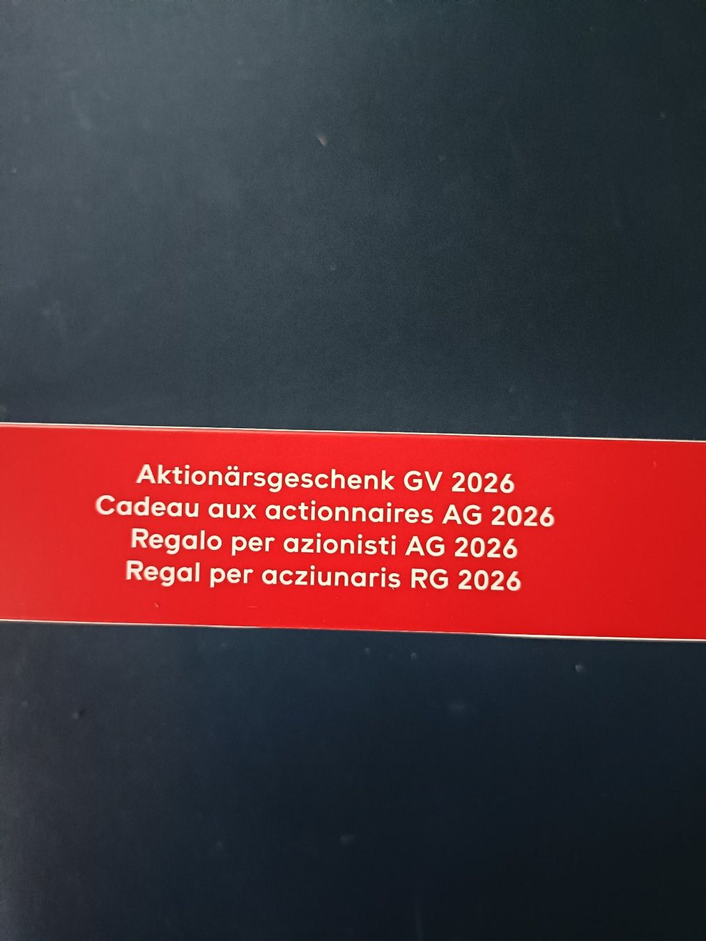 Swatch Orologi: Swatch Aktionärsuhr GV 2026 – Nuovo e nell'imballaggio originale da Grenchen venduto da Schlussliecht 2
