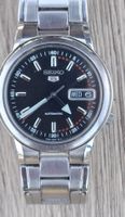 Seiko 5 Day Date Auto Black dial point arrow hour.March 2005