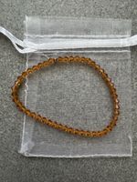 Modearmband aus orange-gelben Steinen