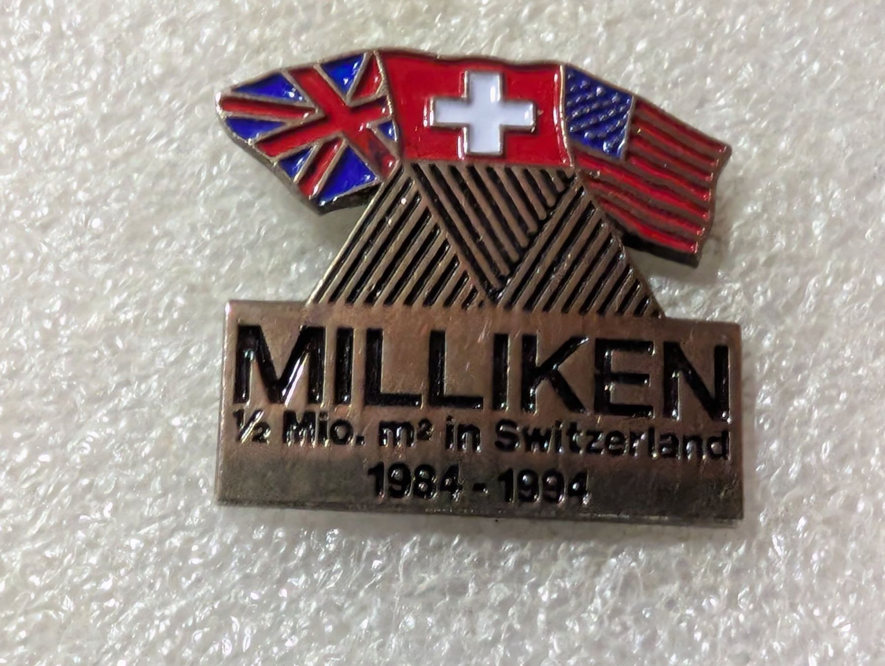 Placchette & Badge: Ansteckpin 85: Milliken – Usato da Oppligen venduto da Pin-Fall-Shop