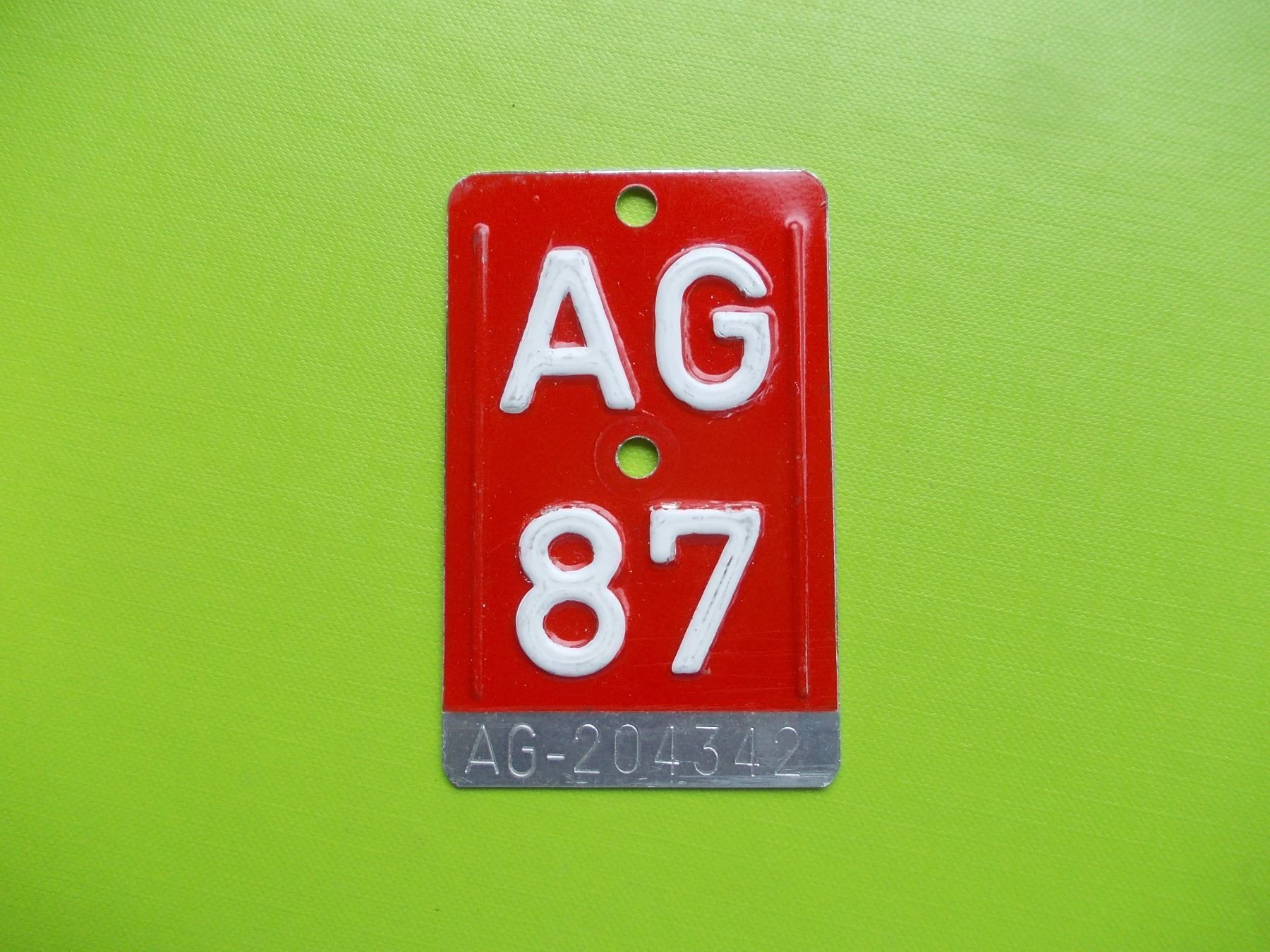 Insegne: Velonummer / Fahrradnummer AG 87 – Usato da Gsteigwiler venduto da HORMIGA21