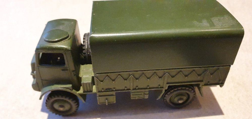 DINKY TOYS, a boxed 673 Scout Car, a boxed 623 Army Covered Wagon and a boxed Dinky Supertoy 10T Arm