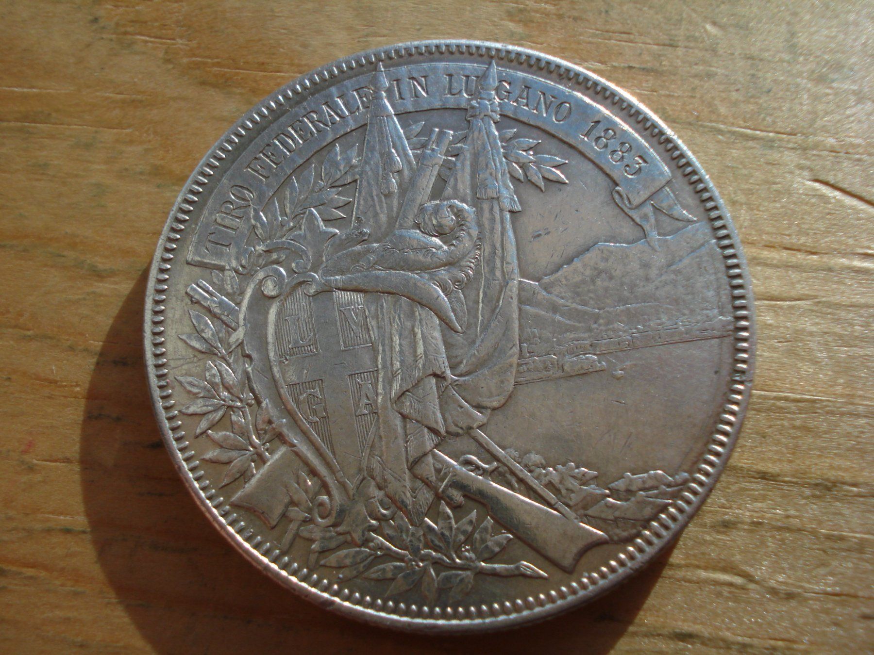 Tutti le monete: (S) 5 Franken Lugano 1883 – Usato da Erlach venduto da Net-Coins