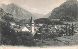 Meiringen (BE) – Dorfansicht mit Kirche und Berner Alpen
