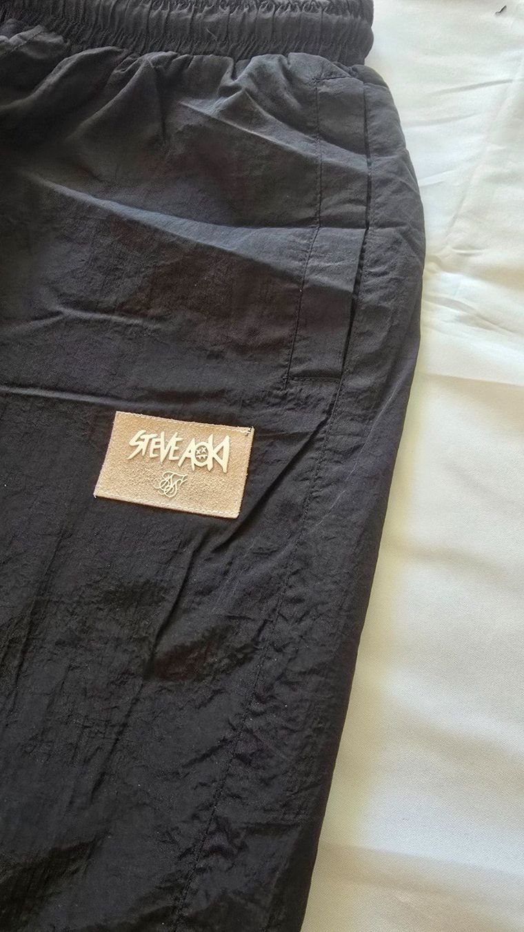 Siksilk Hosen: SikSilk x Steve Aoki Trainerhosen Gr.L – Gebraucht aus Löhningen von Sanmyk 1