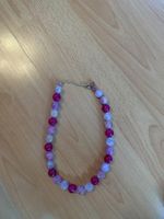 Joli collier en perles roses