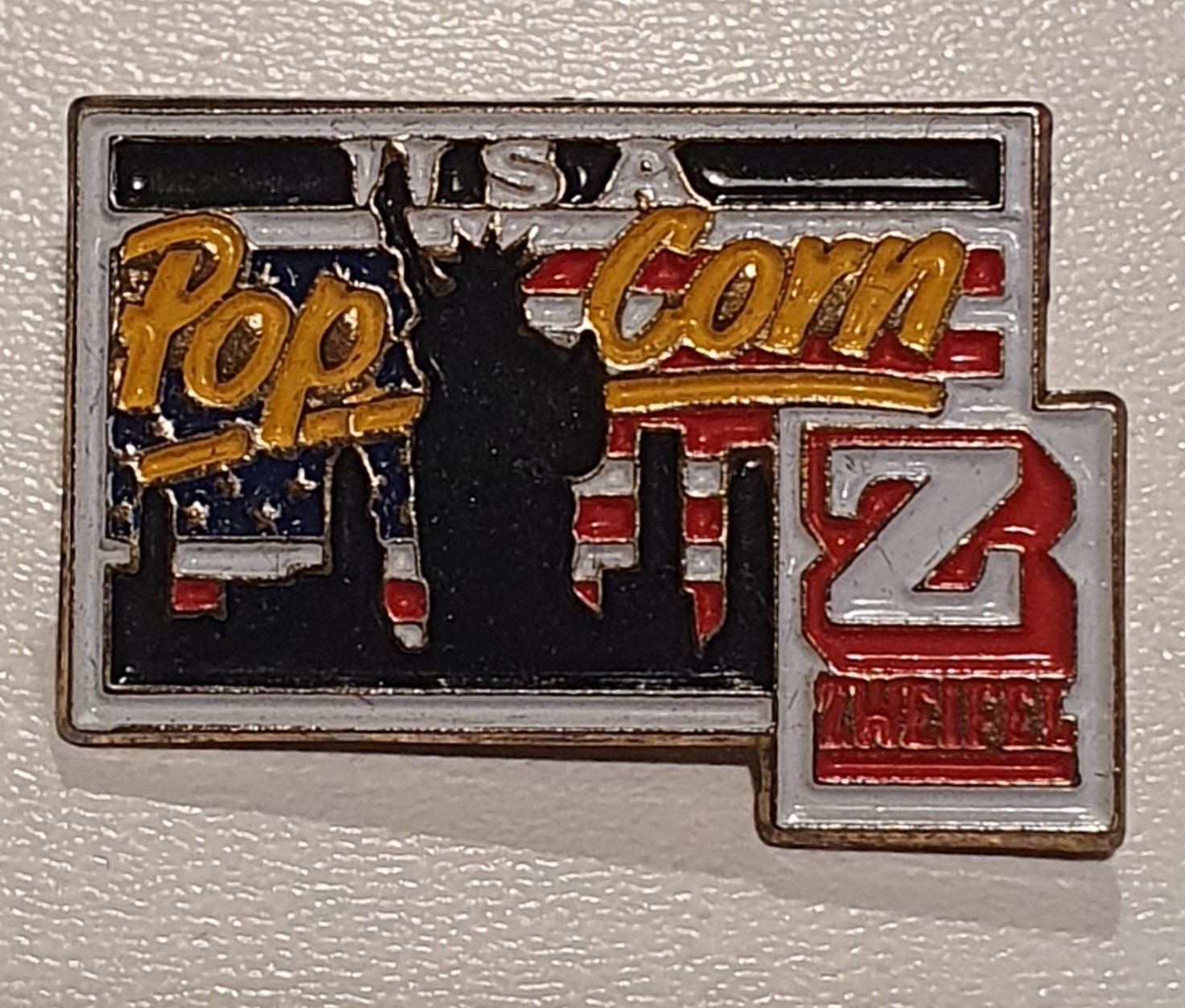 Zweifel Placchette & Badge: Pin's Zweifel pop corn USA – Usato da St-Barthélemy VD venduto da titeuf5