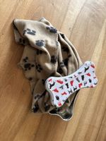 Hübsche Hundedecke mit Blechdose in Knochenform