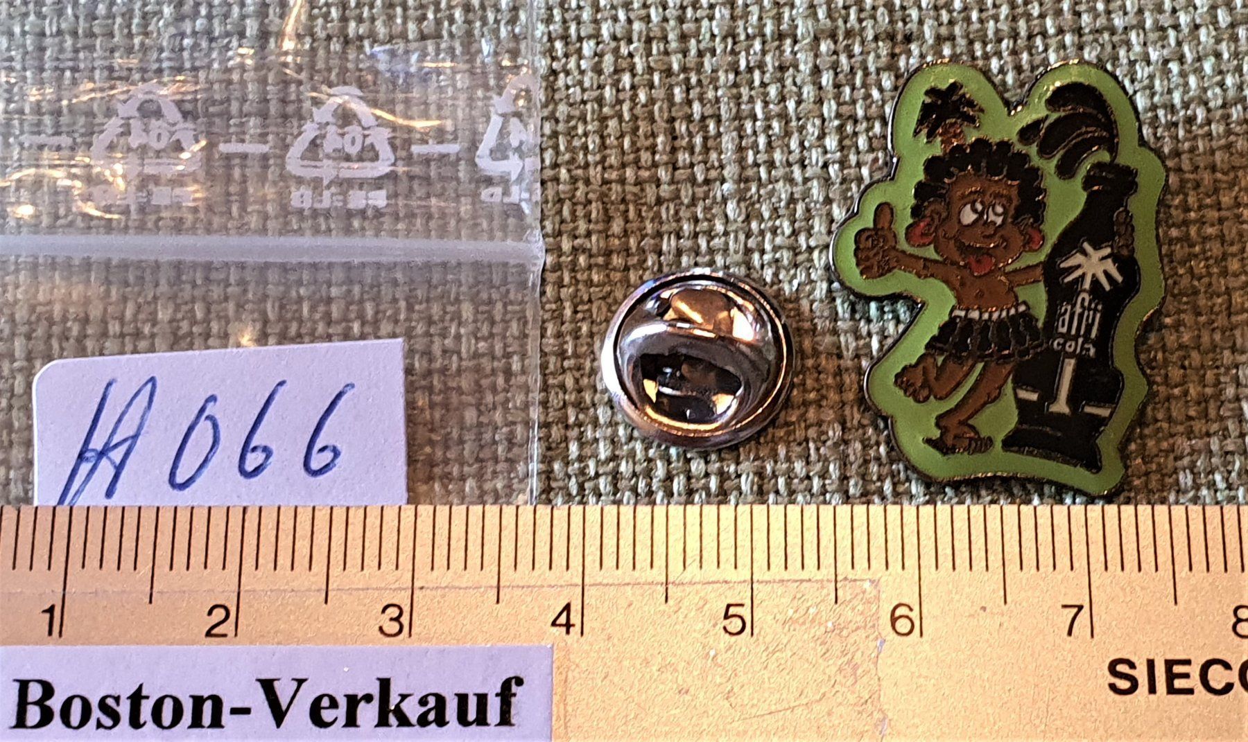Placchette & Badge: H066 - Pin Afri Cola – Usato da Reinach BL venduto da Boston-Verkauf 1