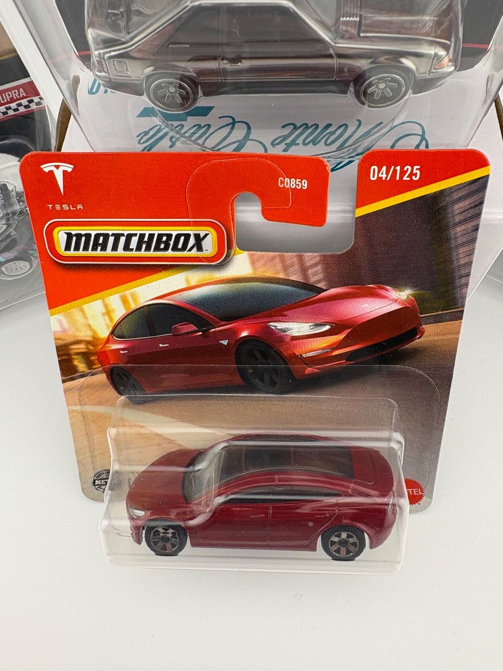 Matchbox Modellini d'auto: Matchbox Tesla Model 3 - 2024 - 4/125 – Nuovo e nell'imballaggio originale da Flawil venduto da HeisseReifen 1