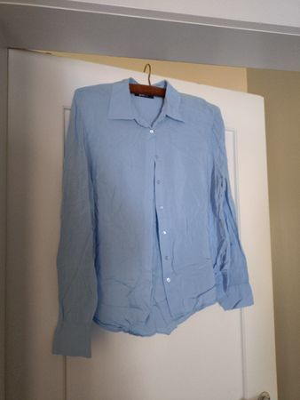 Hellblaue Bluse Gina Tricot