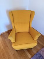 Cosy yellow wingback armchair