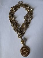 Ceinture Chanel métal doré et strass avec médaille