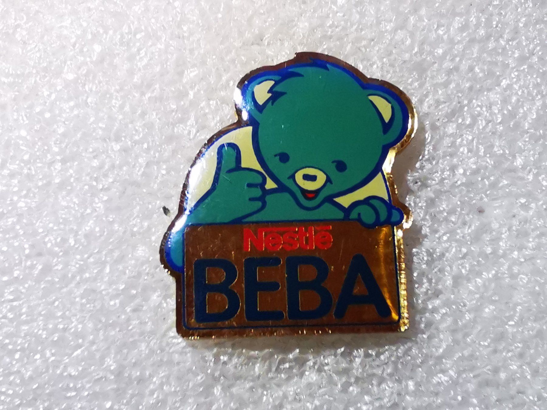 Plaquettes & Badges: Ansteckpin 55: Nestle Beba – D'occasion à Oppligen par Pin-Fall-Shop