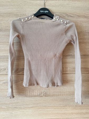 Pull beige manches longues