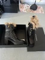 Leder-Stiefeletten mit Fell