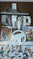 Console Nintendo Wii avec volant et 2 manettes + 5 jeux