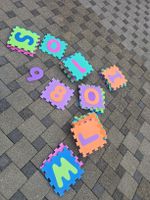 Spielteppich Buchstaben und Zahlen bunt mit Tasche 