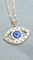 Collana occhio azzurro con zirconi dorata nuovo