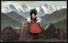 Bernermädchen in Tracht auf einem Berg