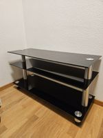 TV-Möbel Schwarz Glas - 3 Ablagen Rollen guter Zustand