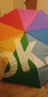 Bunter Regenschirm mit OK Aufdruck - Fröhlich durch den Herb