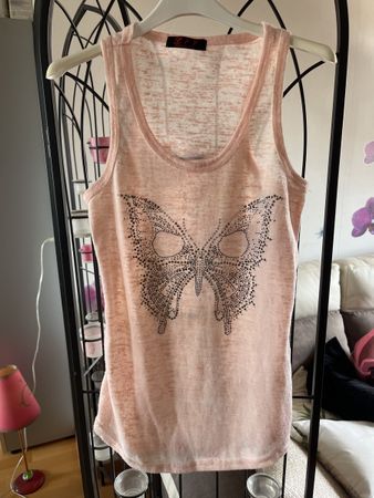 Débardeur rose poudré avec papillon strass, taille TU (S).