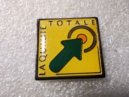 Ansteckpin 9: La Qualite Totale