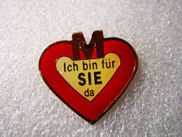 Ansteckpin 13: Migros - Ich bin für Sie da