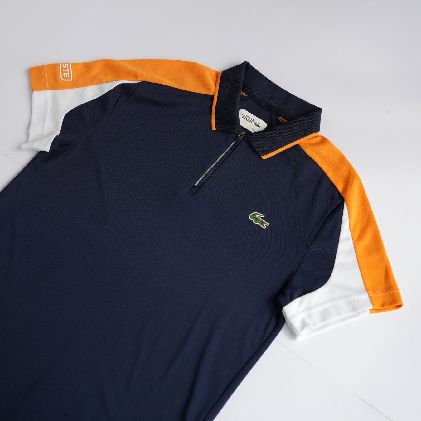 Lacoste Magliette Polo: Lacoste Sport Zip Polo | Navy & Orange – Usato da Zürich venduto da avenlim