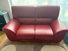 À vendre une fauteuil à deux place en couleur Rouge
