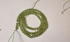 Peridot rund 4 , 5 mm. Strang