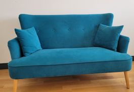 Canapé 2 places vintage en velours bleu turquoise.
