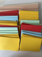 Assorted colored paper sheets, crafting cards, multiple colo