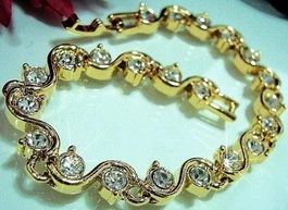 Armband Arm Band Reif gewellt klare Strass Steine Gold