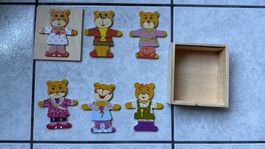 Puzzle in legno con orsetti, vestiti,