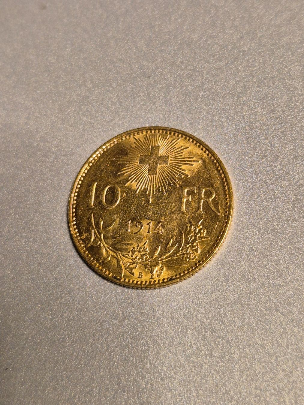 Alle Münzen: Schweizer Goldvreneli 10 Franken 1914 – Gebraucht aus Mels von Goldenfalcon