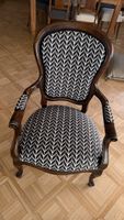 Antiqe Armchair with patterned upholstery dark wood frame