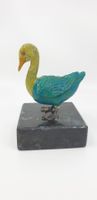 Ente auf Steinsockel