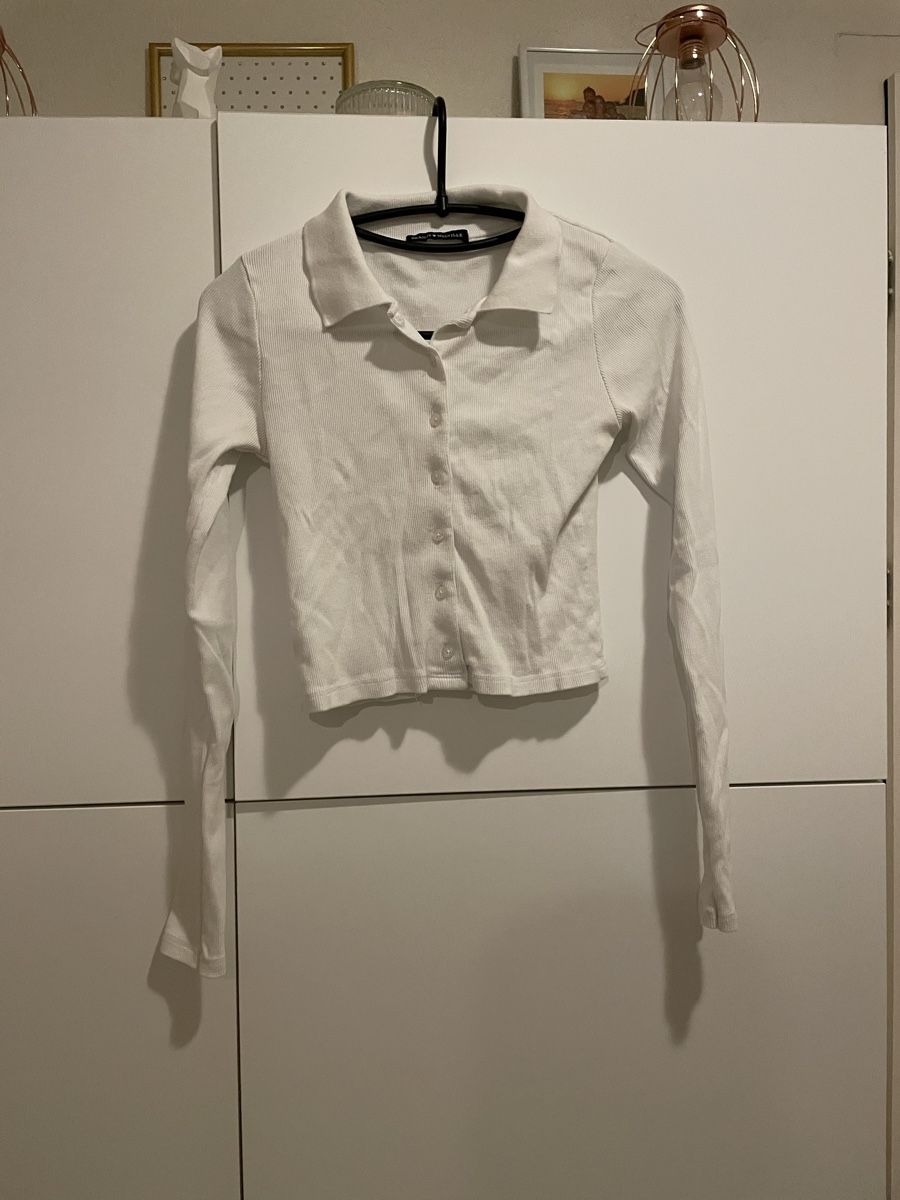 Brandy Melville T-shirt: Polo_pull_top Brandy Melville blanc manches longues – Usato da Pully venduto da kaba07