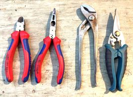 Ensemble d'outils: pinces, clé multiprise, sécateur