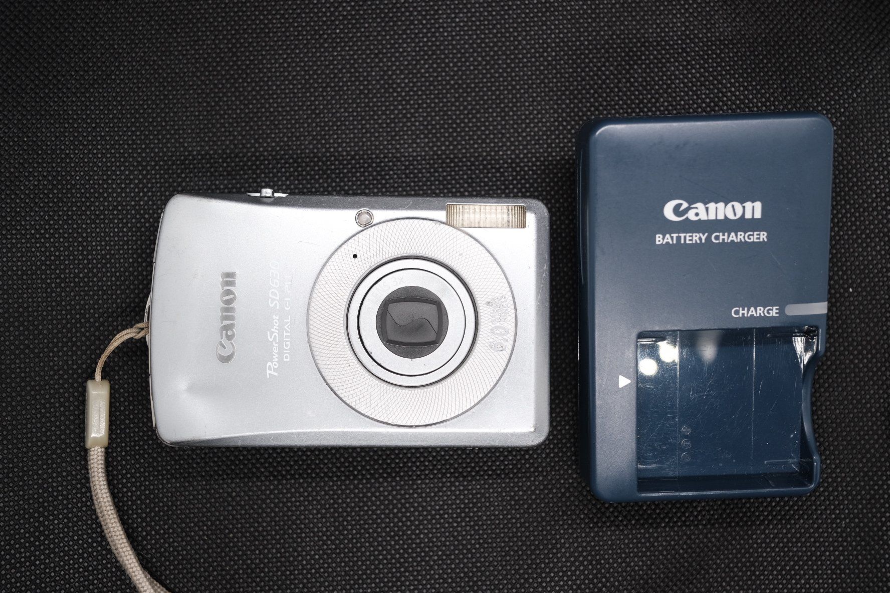 Canon Fotocamera: Canon PowerShot SD630 / Digital IXUS 65 – CCD – Usato da Neuchâtel venduto da Carlosfmunoz