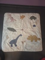 Spieldecke mit Dinosaurier Motiven.